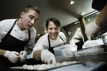 Chef Rene Redzepi (centre) works with one of his assistants in the kitchen of his two Michelin star restaurant Noma, which was voted the best restaurant in the world in 2010.