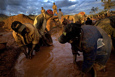 Men working in a small scale gold mine. Thousands of Zimbabweans have crossed into neighbouring Mozambique in search of work, and many have turned to gold mining.