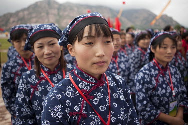Female competitors dressed as revolutionary volunteers  participate in the Red Games. Held in Junan County, this sporting event is a nostalgic tribute to the communist era.