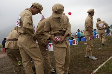 Competitors dressed in PLA (People's Liberation Army) revolutionary era outfits participate in the Red Games. Held in Junan County, this sporting event is a nostalgic tribute to the communist era.