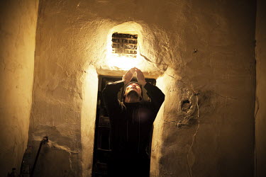 A Muslim inmate with MDR TB (multi-drug-resistant tuberculosis), prays in his 6m2 cell. He is an inmate of Prison Colony 27. Kyrgyzstan's prisons are experiencing a TB epidemic, where the incidence ra...