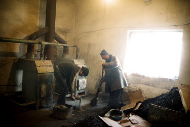 Men tend to the newly renovated heating system at the specialised prison-colony 27, which houses detainees with MDR TB (multi-drug-resistant tuberculosis). Kyrgyzstan's prisons are experiencing a TB e...