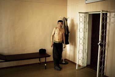 A detainee at Specialised Prison Colony 27 who has MDR TB (multi-drug-resistant tuberculosis), waits to be X-rayed. Kyrgyzstan's prisons are experiencing a TB epidemic, where the incidence rate is est...