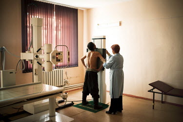 A detainee at Specialised Prison Colony 27 who has MDR TB (multi-drug-resistant tuberculosis) is X-rayed by a doctor. Kyrgyzstan's prisons are experiencing a TB epidemic, where the incidence rate is e...