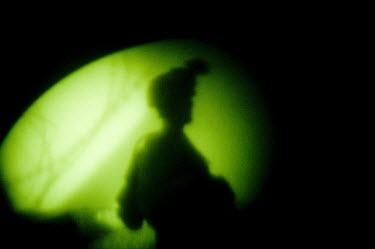 A US marine viewed with night vision participates in a security patrol.