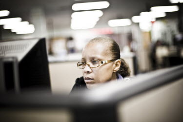 38 year old Antoinette sits at a computer looking for a job at the WorkForce One job centre in Hollywood, Florida. She holds a bachelor's degree in pre-law and used to work for a computer company. Ant...