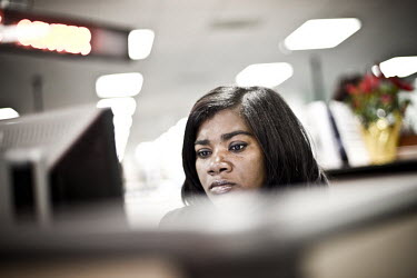 35 year old Isheka sits at a computer looking for a job at the WorkForce One centre in Hollywood, Florida. She comes to the job centre every day. She left her job in a laboratory for personal reasons...
