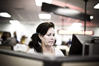 52 year old Karen sits at a computer looking for a job at the WorkForce One centre in Hollywood, Florida. She comes to the job centre every day. Karen worked as a cashier for a long time - 'I used to...