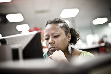 31 year old Kim sits at a computer looking for a job at the WorkForce One centre in Hollywood, Florida. She has been coming to the job centre for a month after the company she worked for downsized.