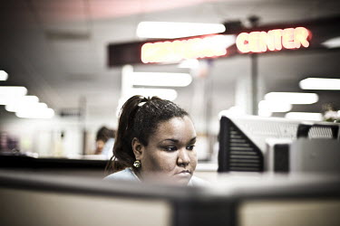 23 year old Marie sits at a computer looking for a job at the WorkForce One centre in Hollywood, Florida. She has been coming to the job centre every day for two weeks and lost work five months ago. '...