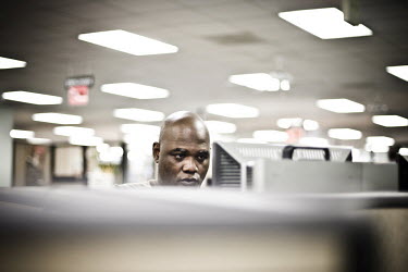 38 year old James sits at a computer looking for a job at the WorkForce One centre in Hollywood, Florida. It is his first time at the job centre. He used to work in sales management but lost his job t...