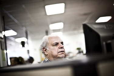 A man sits at a computer looking for a job at the WorkForce One centre in Hollywood, Florida. He has been out of work for three months so now comes to the job centre every day. He sometimes works as a...