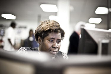50 year old Eda sits at a computer looking for a job at the WorkForce One centre in Hollywood, Florida. She comes to the job centre two or three times a week. She was laid off from her job as an offic...