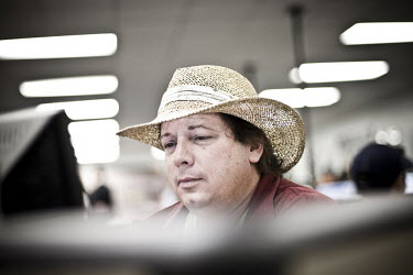 49 year old Kenneth sits at a computer looking for a job at the WorkForce One job centre in Hollywood, Florida. He used to live in Kentucky, but after he couldn't find work there he moved to Florida c...