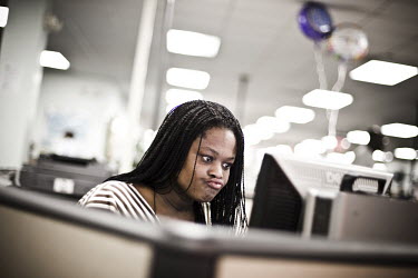 30 year old Diana sits at a computer looking for a job at the WorkForce One centre in Hollywood, Florida. It is her first time at the job centre. 'I used to have my own business as an event planner bu...