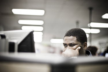 29 year old James sits at a computer looking for a job at the WorkForce One centre in Hollywood, Florida. It is his second time at the job centre. He lost work five months ago.