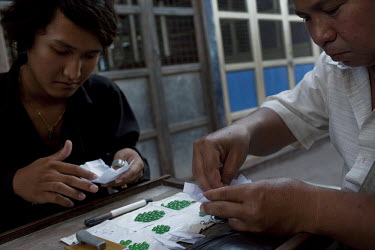 Jade traders show their wares at the Jade Market in Mandalay. Much of the Burmese junta's wealth comes from the trade in precious stones.