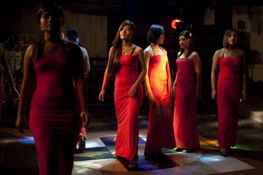 Sex workers are paraded in a line-up at a night-club 'fashion show' in Yangon.