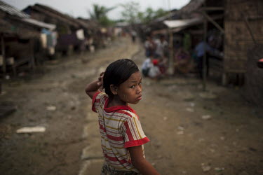 A child walks through the Hlaing Thaya slum district of Yangon.