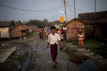 A man walks through the Hlaing Thaya slum district of Yangon.