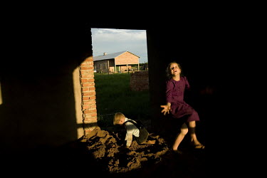 Children play together by their house in a Mennonite village. Near the city of Santa Cruz, there are about 15,000 Mennonites living in isolated communities. Mennonites are a group of Christian Anabapt...