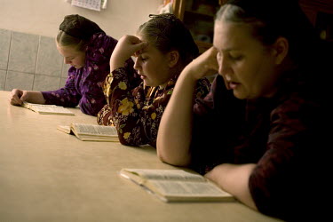 A family sing religious songs at their home in a Mennonite village. Near the city of Santa Cruz, there are about 15,000 Mennonites living in isolated communities. Mennonites are a group of Christian A...