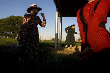 A woman and her daughters on a farm in a Mennonite village. Near the city of Santa Cruz, there are about 15,000 Mennonites living in isolated communities. Mennonites are a group of Christian Anabaptis...