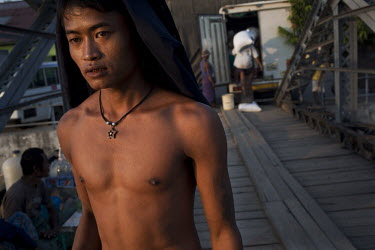 A dock labourer working at the Rangoon (Yangon) river docks.