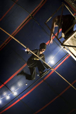 Jhon Estevan blindfolded on the high-wire at the Jhon Danyer Circus. Around a dozen small circuses wander the poorer neighbourhoods around the city of Medellin putting on performances in what can be a...