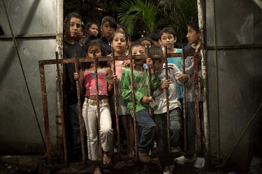 Tickets in hand, children wait expectantly for the evening performance of Jhon Danyer Circus in the Bello Horizonte neighbourhood. Around a dozen small circuses wander the poorer neighbourhoods around...