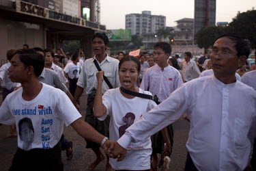 National League for Democracy (NLD) supporters, celebrate as they march from their party HQ to Aung San Suu Kyi's home following her release from house arrest in Rangoon. From 1990 until her release o...