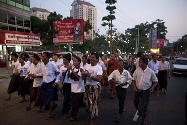 National League for Democracy (NLD) supporters, celebrate as they march from their party HQ to Aung San Suu Kyi's home following her release from house arrest in Rangoon. From 1990 until her release o...