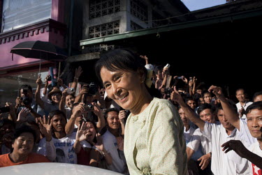 Aung San Suu Kyi gets into a car outside the National League of Democracy party headquarters the day after her release from house arrest in Rangoon. From 1990 until her release on 13 November 2010, Au...