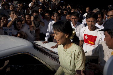 Aung San Suu Kyi gets into a car outside the National League of Democracy party headquarters the day after her release from house arrest in Rangoon. From 1990 until her release on 13 November 2010, Au...