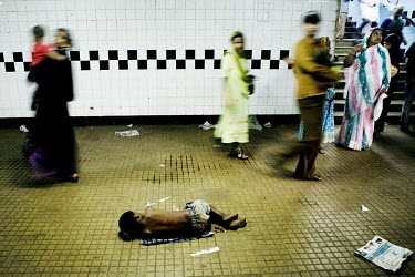 A child sleeps on a small piece of fabric in an underpass in Mumbai. It is estimated that there are 11 million street children in India - at least 125,000 children live on the streets of Mumbai.