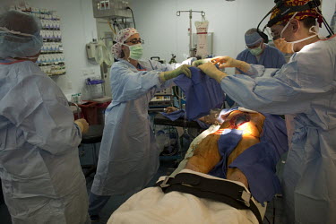 A US Army soldier is operated on after having his spleen removed following a rocket attack on his vehicle, at the Bagram base's SSG Heath N. Craig Joint Theatre Hospital.