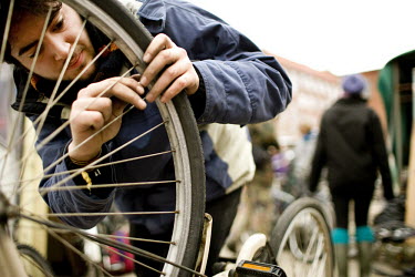 An activist mends his bicycle at a protest at the UN summit on climate change (COP15) in Copenhagen.