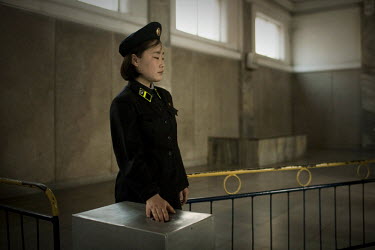 A Metro worker waits to collect tickets at a station in Pyongyang.