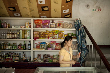A shopkeeper in a store in Pyongyang.
