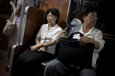 Passengers ride on a Metro train in Pyongyang.