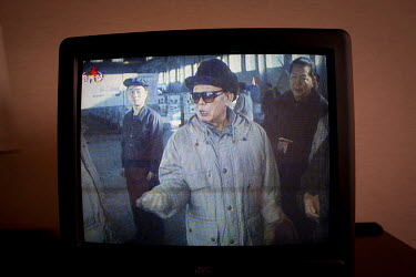 Supreme Leader Kim Jong-il appears on a television set in Pyongyang,.