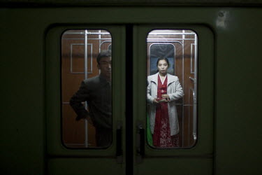 Passengers wait for a Metro train to leave a station in Pyongyang.