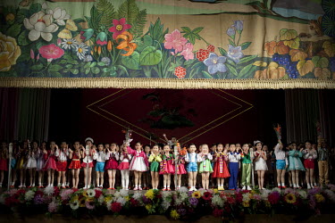 Young children aged 5 and 6 perform in a song and dance propaganda show at the Schoolchildren's Palace in Pyongyang.