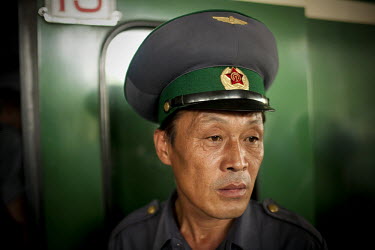 A ticket collector collects tickets at Pyongyang Train Station.