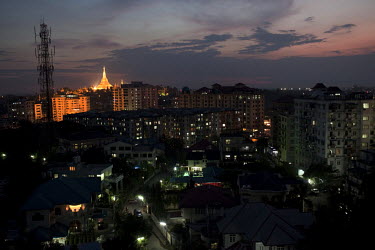 Shwedagon Pagoda is illuminated at night on the Yangon skyline.