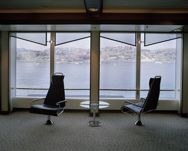 Seats on a luxury cruise liner as it passes the town of Uummannaq.