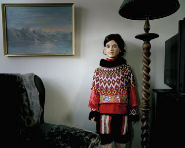 A mannequin in a house wearing a traditional Inuit outfit.