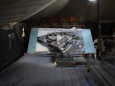 A tent contains a poster with the building plans for a new mosque to be built in Simferopol.