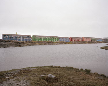 A view of a residential area next to a lake in Nuuk.