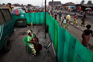 37 year old Josephine Mpongo practises the cello in the Kimbanguiste neighbourhood of Kinshasa. She plays with the Kimbanguiste Symphony Orchestra, who practise here 5 days per week.